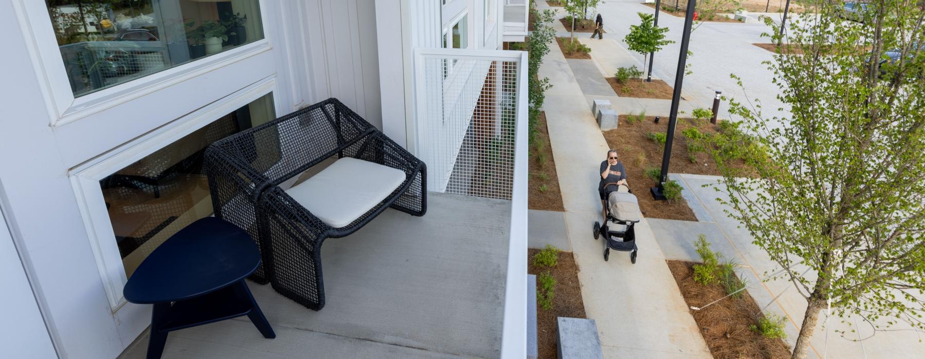 a patio with chairs and a table